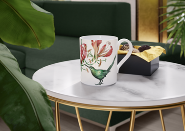 Villeroy & Boch. Humming bird mug on white coffee table